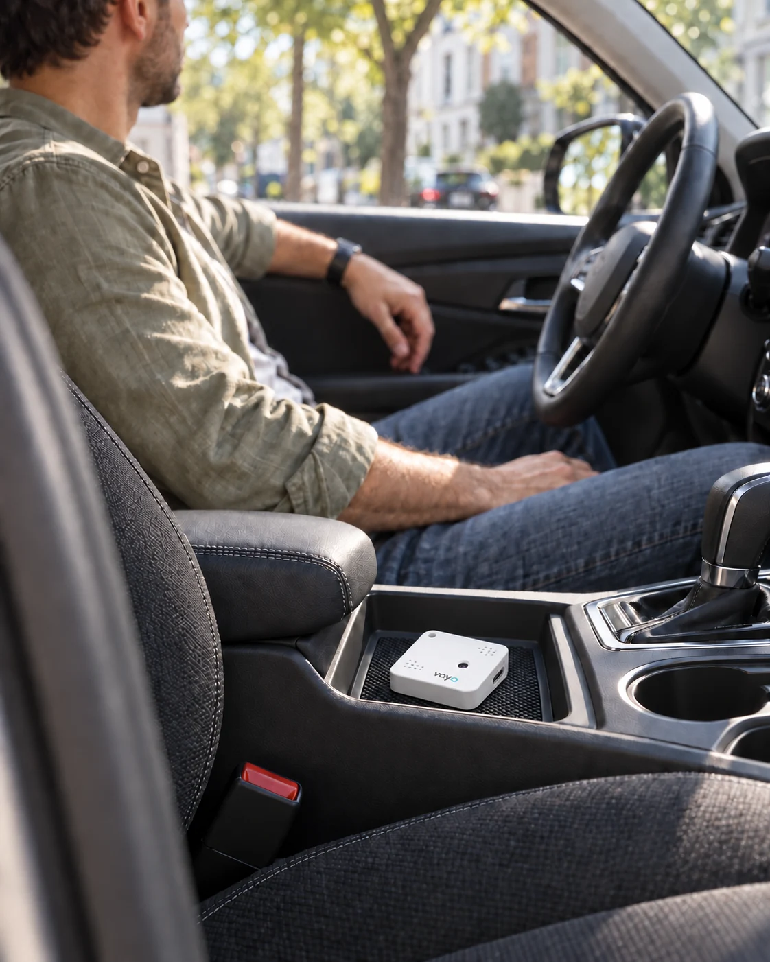 Vayo One beside the gear selector in a parked car